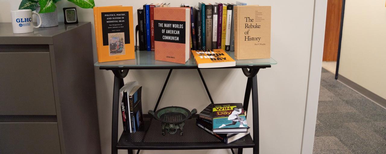 books on a shelf written my history department professors